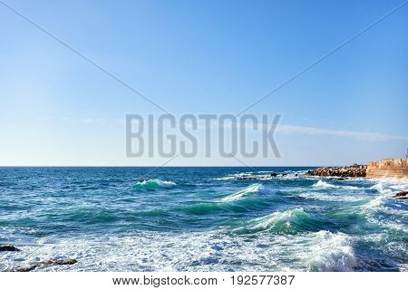 Beautiful view of sea and beach background with breakwater