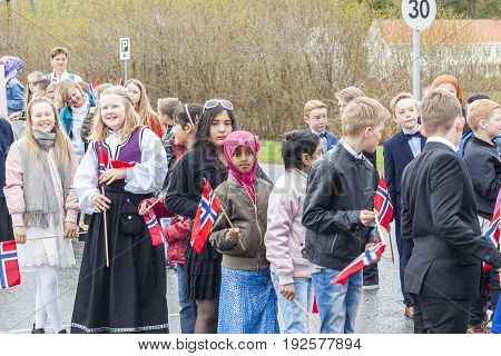 VERDAL NORWAY - MAY 17 2017: National day in Norway. Norwegians at traditional celebration and parade on may 17 2017 in Verdal. People on parde before school in Verdal. Constitution Day is the National Day of Norway.