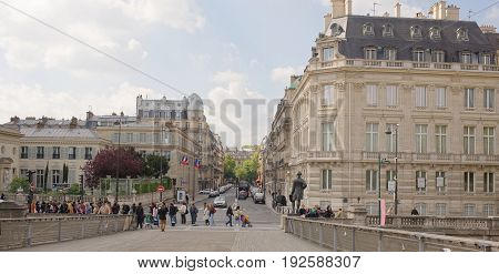 ParisFrance- April 29 2017: View from the Bridge Leopold Sedar Sangor on Solferino Street. People walk along the waterfront