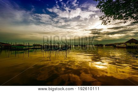 Homestay and floating basket in lake at Kohyo Songkhla Thailand with beautiful sky and clouds. This is traditional fisheries area.