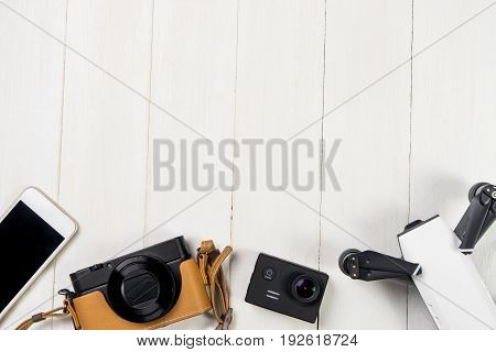 Vacation travel Gadgets on white wooden copy space