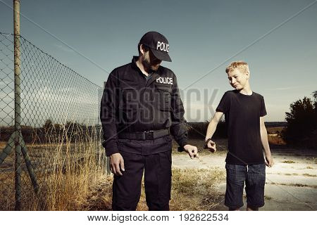 Teenager taken to handcuffs by police man