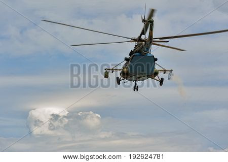 Russian Military Helicopter Mi-8 In The Cloudy Sky
