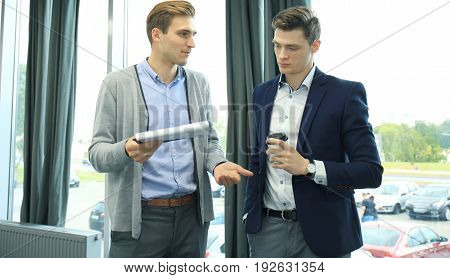 Two businessman dicussing business in the office