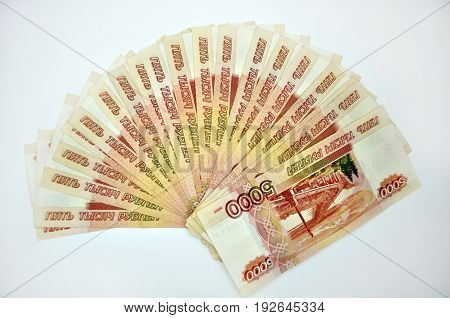 a lot of 5000 banknotes of Bank of Russia on white background Russian rubles spine 100 banknotes of five thousand rubles