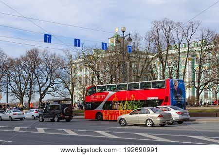 SAINT PETERSBURG RUSSIA - MAY 1 2017: Excursion bus City Tour on Palace passage near State Hermitage Museum. Unknown people are resting outdoors in historic center of city St. Petersburg