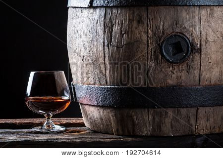 Glass Of Good Brendy And Oak Barrel