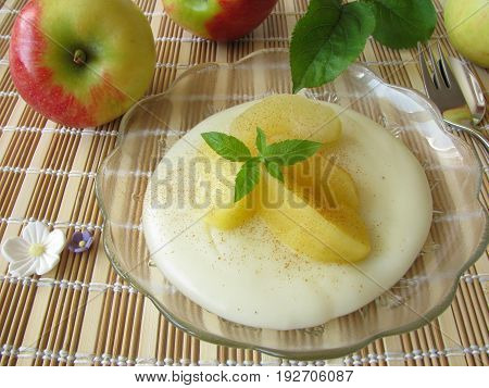 Homemade gluten free dessert with blancmange from maize starch and stewed apples