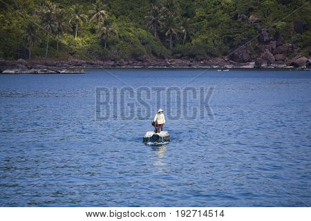PHU QUOC, VIETNAM - March 21, 2017: Lifestyle of fisherman on his boat in An Thoi pier village, Phu Quoc island, Vietnam