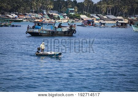 PHU QUOC, VIETNAM - March 21, 2017: Lifestyle of fishermen on their boats in An Thoi pier village, Phu Quoc island, Vietnam