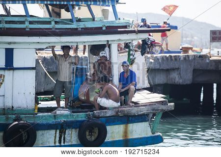 PHU QUOC, VIETNAM - March 21, 2017: Lifestyle of fishermen on their boats in An Thoi pier village, Phu Quoc island, Vietnam