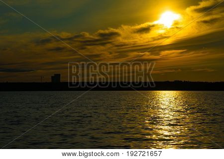 Orange And Red Sunset At Coast Of The Lake