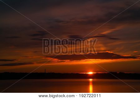 Orange And Red Sunset At Coast Of The Lake