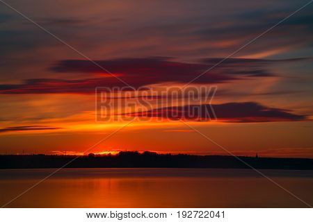 Orange And Red Sunset At Coast Of The Lake