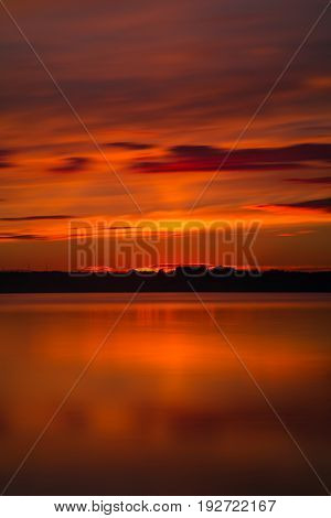 Orange And Red Sunset At Coast Of The Lake