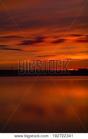 Orange And Red Sunset At Coast Of The Lake