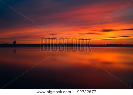 Orange And Red Sunset At Coast Of The Lake