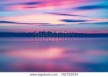 Orange And Red Sunset At Coast Of The Lake
