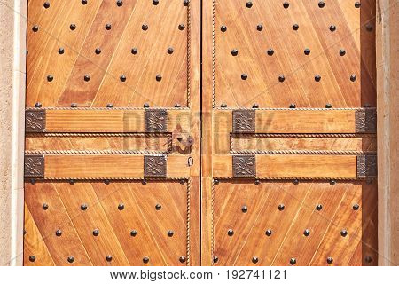 Old wooden doors with forging orange color