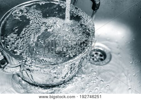 Clean Water In The Kitchen Sink, Water Rinse In Pot Waste In Household.