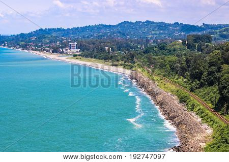 BATUMI GEORGIA-JULY 9 2015 Beautiful Scenic Summer View From Botanical Garden Of Sea Bay And Railroad On Coast. The Lush Green Vegetation Of Summer. Sunny Day.