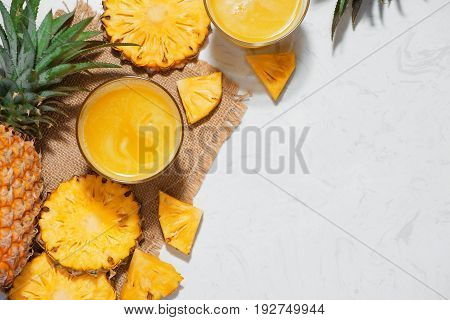Top View Of Fresh Pineapple Juice In The Glass With Pineapple Fruit