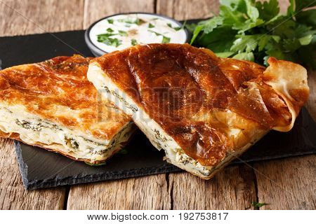 Homemade Sliced Burek Stuffed With Spinach And Cheese Close-up. Horizontal