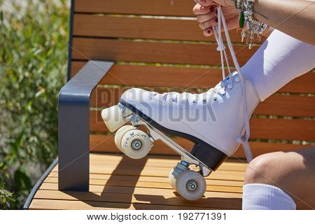 The girl assumes roller skates