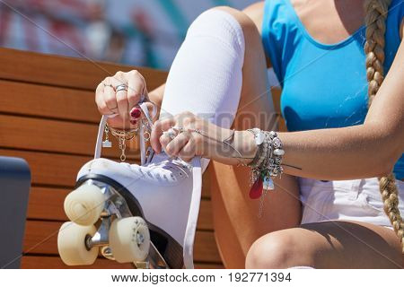 The girl assumes roller skates