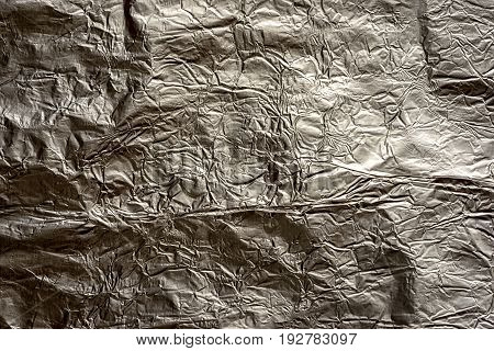dark crumped silver metal foil background texture