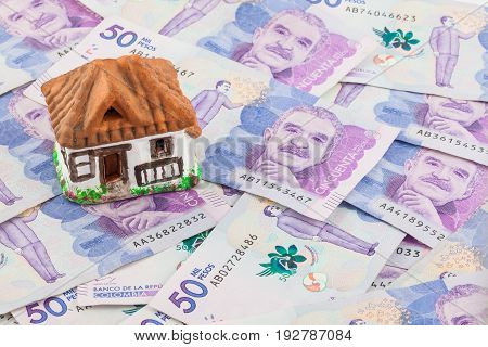 Saving Fifty Thousand Colombian Pesos Bills to buy a house