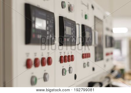 Main electric control board inside a factory (blurred picture)