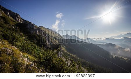 High mountain ridge and foggy valley during sunrise, Koschuta, Slovenia