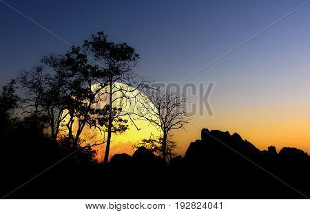 Night landscape with the Moon over the mountain