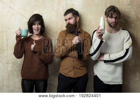 Woman Showing Thumbs Up With Cup And Two Men