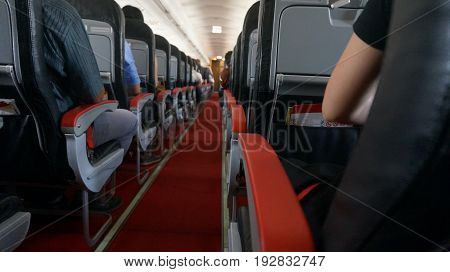 Interior of airplane with passengers on seats .waiting to take off.