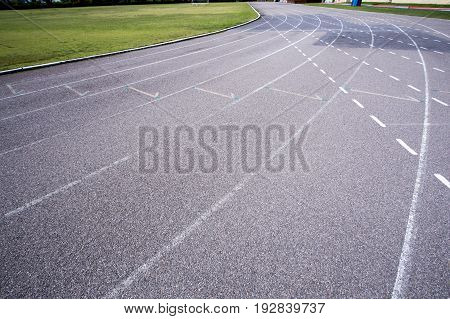 Gray treadmill at the stadium with the numbering from one to seven