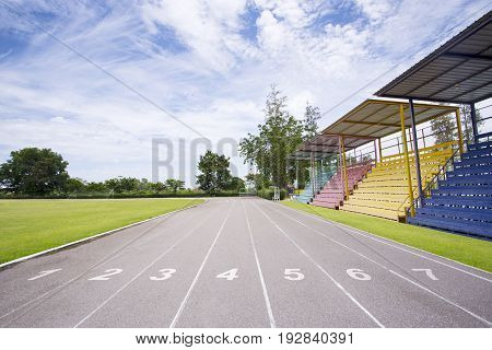 Gray treadmill at the stadium with the numbering from one to seven