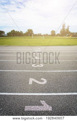 Gray treadmill at the stadium with the numbering from one to eight