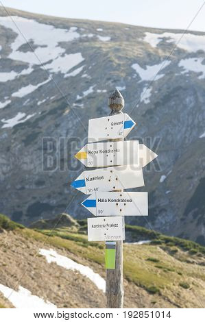Poland Tatra mountains Signpost at Kondracka Przełęcz reamins of snow