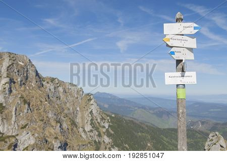 Poland Tatra mountains Signpost at Kondracka Przełęcz overcast sky