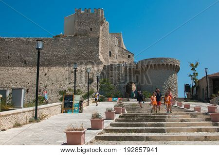 TREMITI ISLANDS, ITALY - JUNE 25, 2017: Tourists visiting the Badiali castle in the island of San Nicola, Puglia
