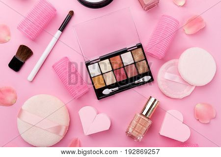 Beauty Spa Feminine Concept. Different Make Up Beauty Care Essentials Cosmetics on Flat Lay Pink Background. Top View. Above.