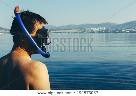 Young Man Diver With Scuba Mask And Snorkel On Background Of Sea With Space. Tourism Travel Journey Freediving Concept