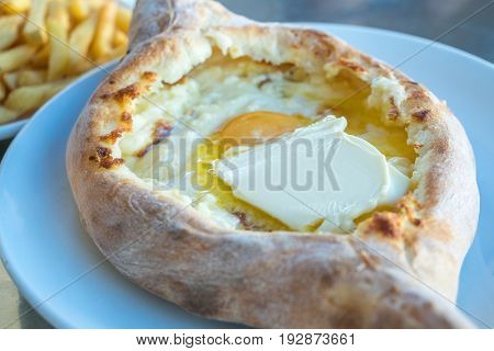 Adjarian Khachapuri With Eggs On The Table