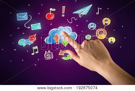 Female hand toucing mixed media icons with purple background