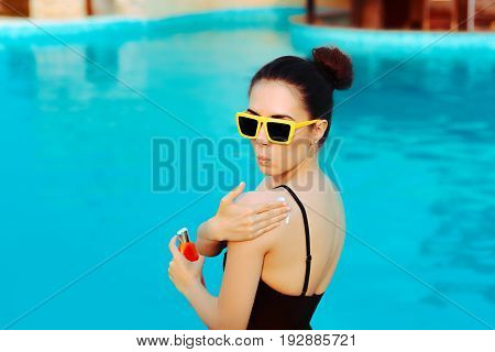 Summer Girl Applying Suncream Lotion by the Pool