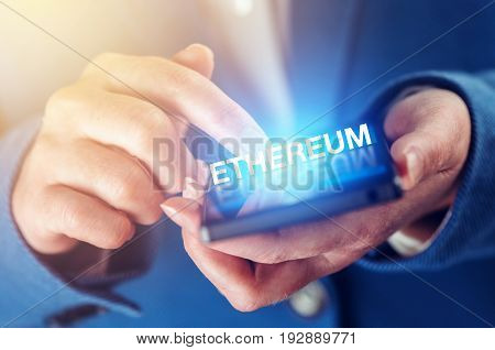 Ethereum cryptocurrency concept with female hands and smartphone