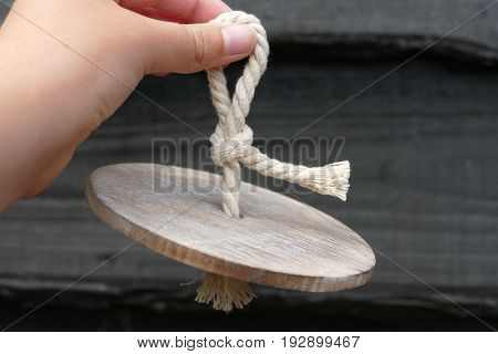 a wooden shell with a white cable