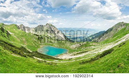 Remote Gaisalpsee lake up high in the alpine mountains in spring or summer. Bavaria, Allgau, Germany.